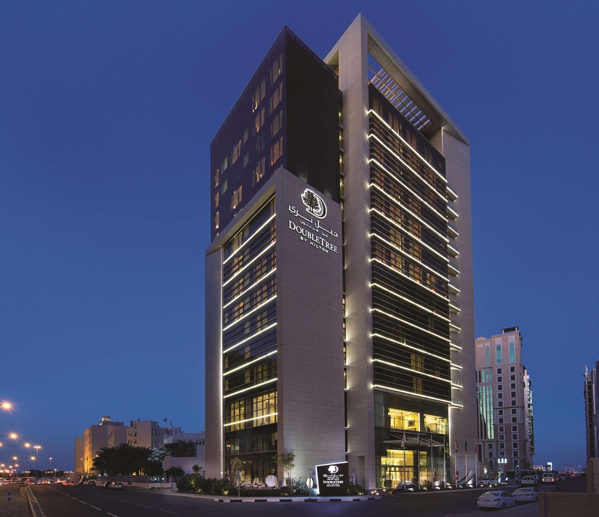 Doubletree By Hilton Doha Old Town Hotel Exterior photo The hotel at night